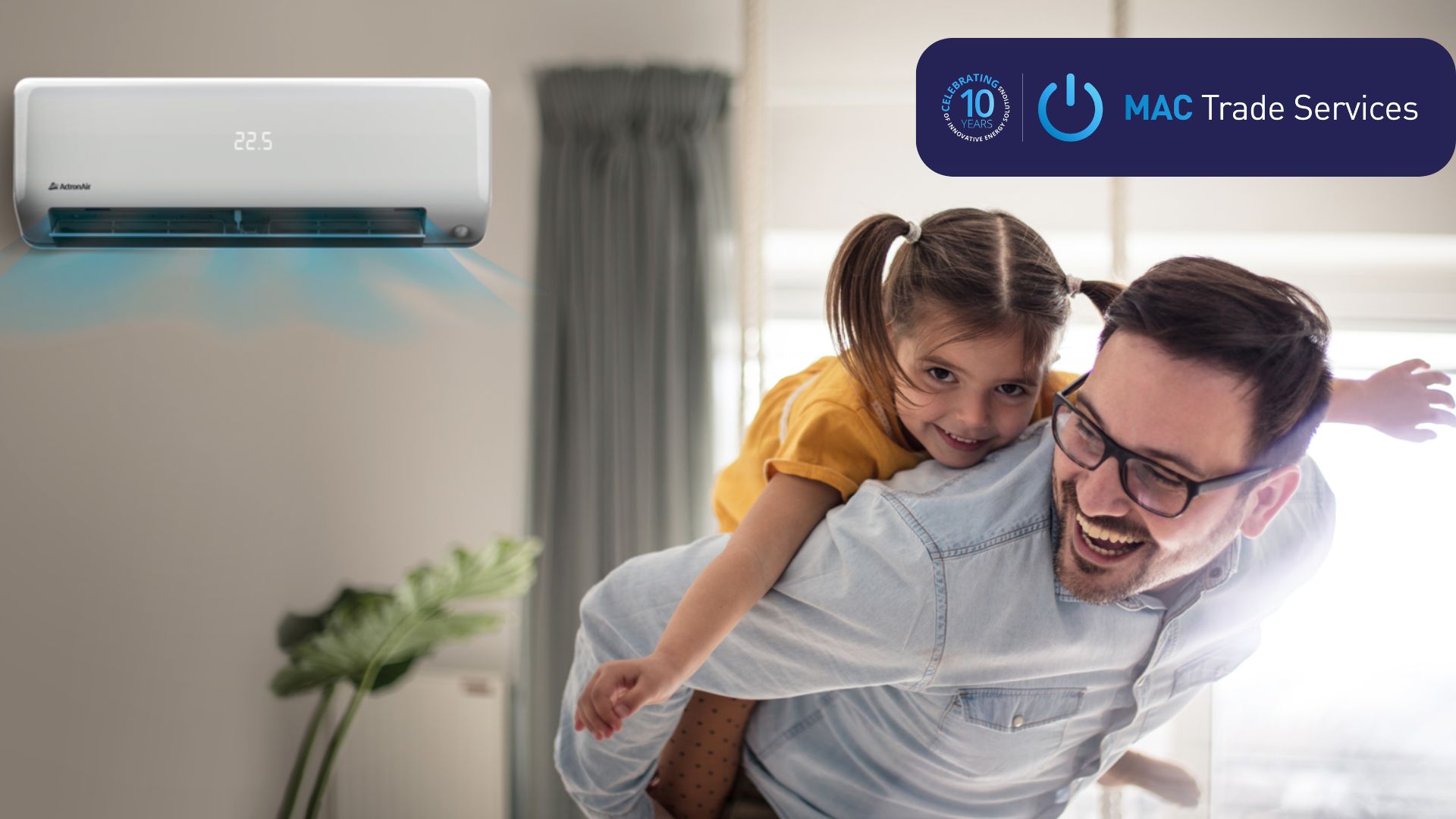 A smiling man gives a piggyback ride to a happy young girl in a bright room. An air conditioner on the wall displays "22.5." The MAC Trade Services logo and an appliance rebate offer appear in the top right corner.